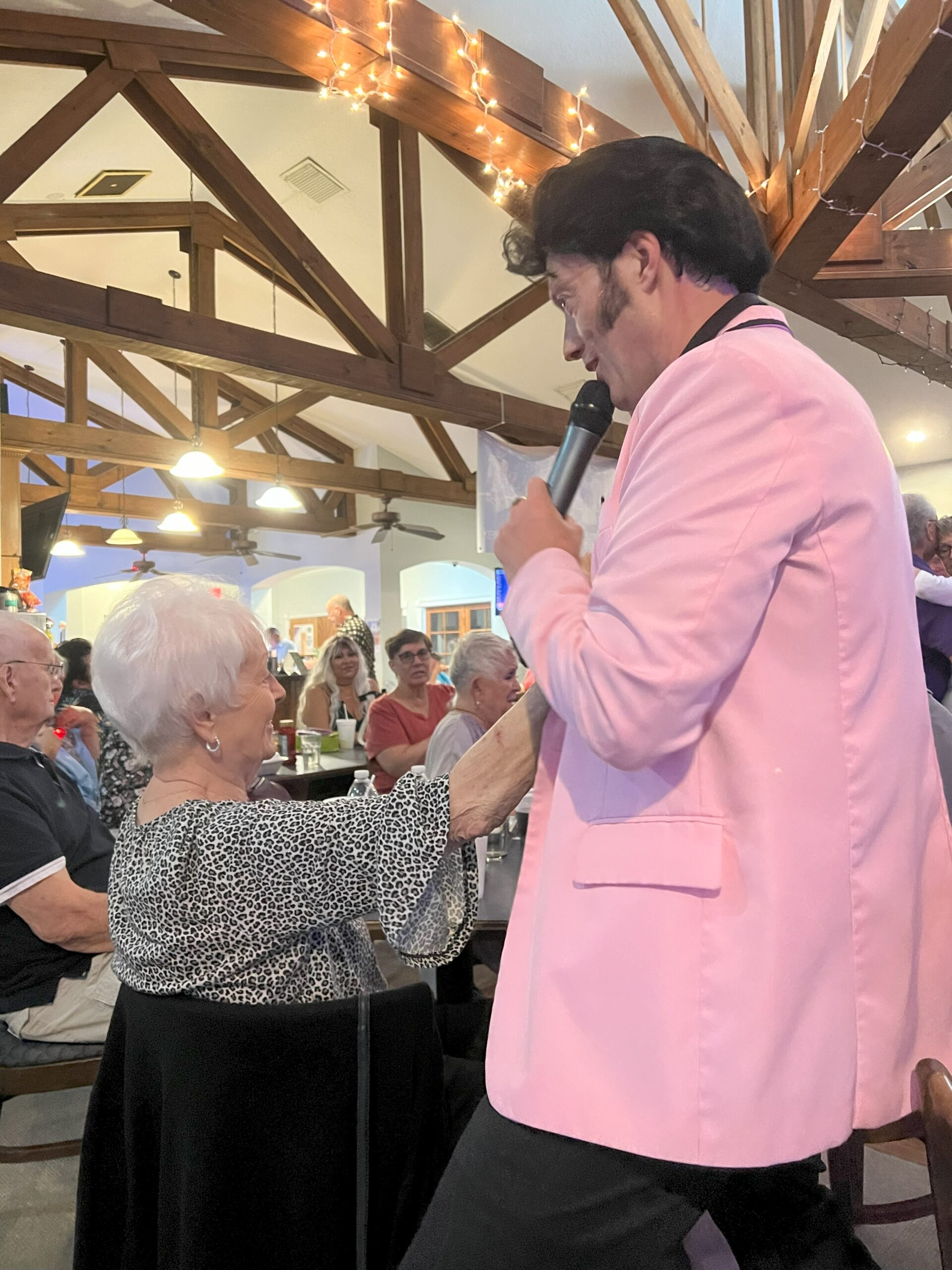 Randy Elvis crooning with Superfan Toni.