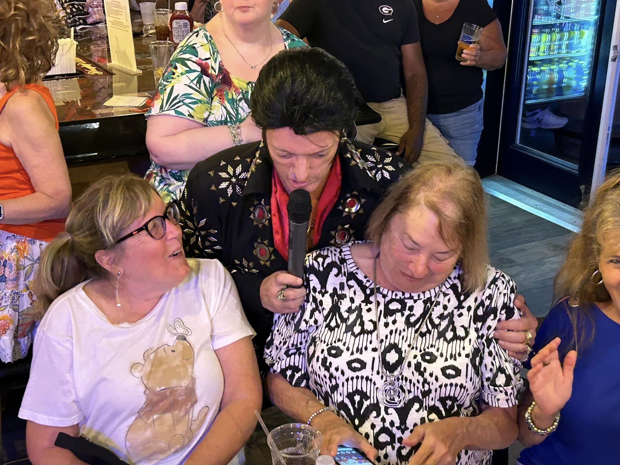 Randy surrounded by ladies at Red, White, & Blues in Palm Coast.